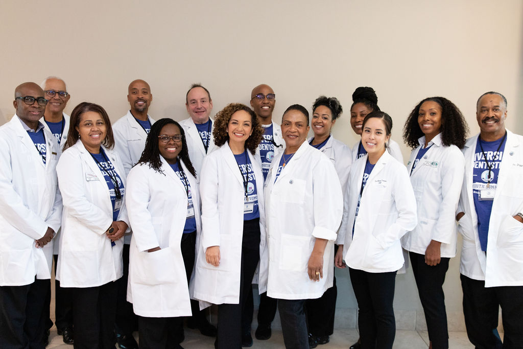 Group of dentist mentors in white coats