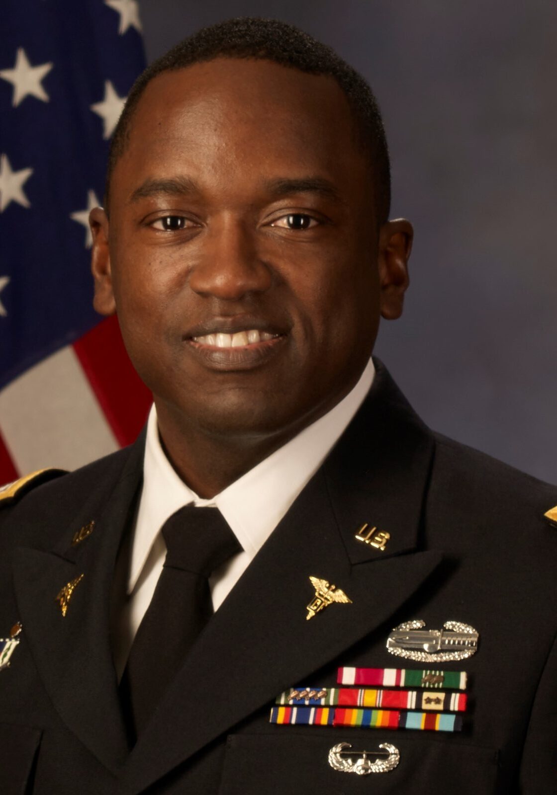 Dr. Dentonio Worrell, a Brooklyn native, journeyed from Barbados to a successful dental career. After graduating from the University of Maryland Dental School, he served as a US Army General Dentist for five years. Specializing in Endodontics, he earned board certification in 2012. Presently, he leads the US Army Dental Health Activity-Hawaii, mentors in a residency program, and enjoys family time, travel, hiking, investing, and volunteering.